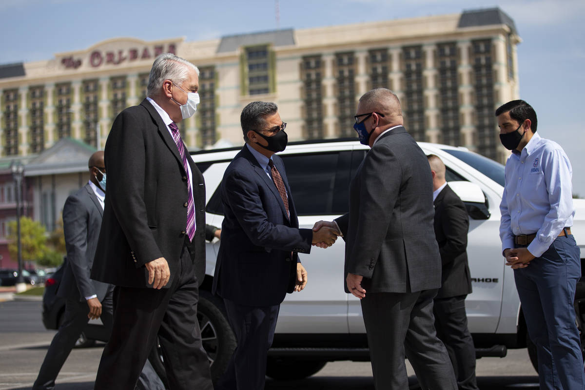 Nevada Governor Steve Sisolak, from left, U.S. Health and Human Services Secretary Xavier Becer ...