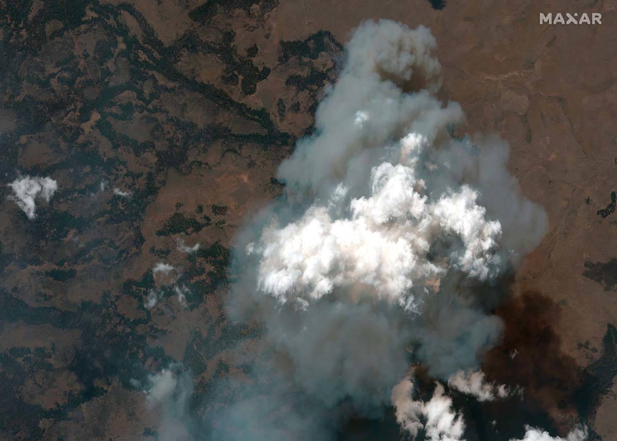 This satellite image provided by Satellite image ©2021 Maxar Technologies the Bootleg Fire ...