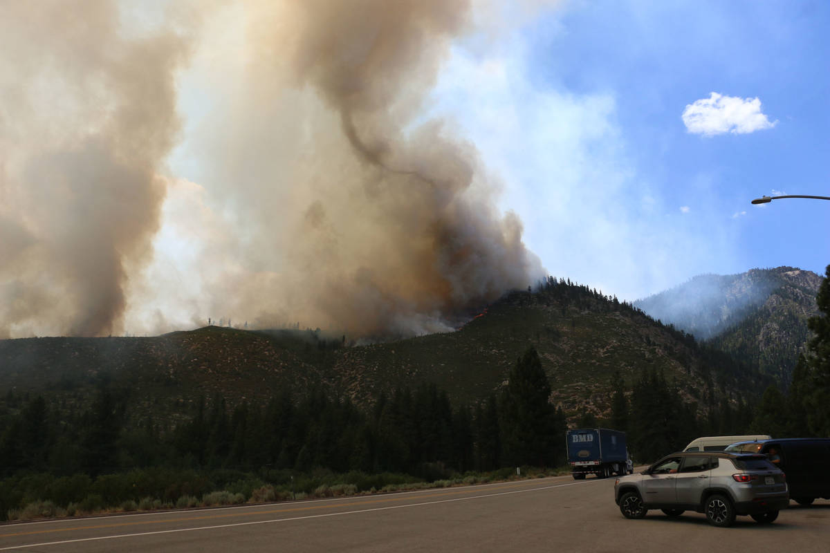 The Tamarack Fire is seen approaching Highway 88 near Woodfords in Alpine County on July 20, 20 ...