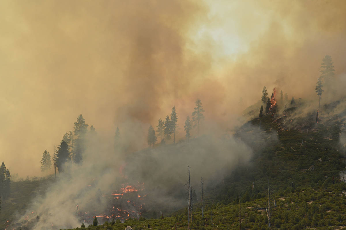 The Tamarack Fire is seen approaching Highway 88 near Woodfords in Alpine County on July 20, 20 ...