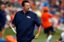 FILE - In this Aug. 4, 2016, file photo, Denver Broncos quarterbacks coach Greg Knapp watches d ...
