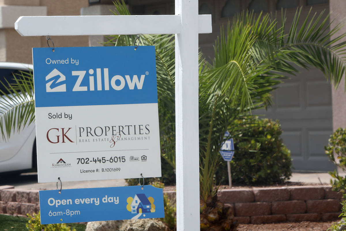 A sale sign is seen in front of a Zillow-owned house at 5296 Tartan Hill Ave. in Las Vegas, Fri ...