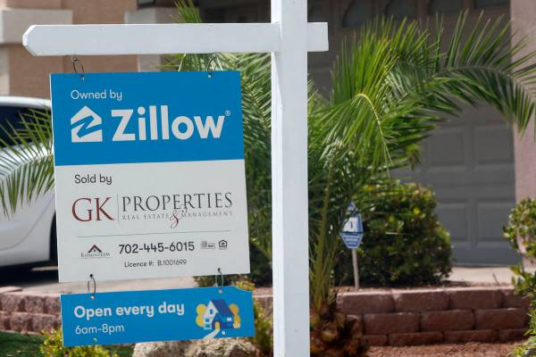 A sale sign is seen in front of a Zillow-owned house at 5296 Tartan Hill Ave. in Las Vegas, Fri ...