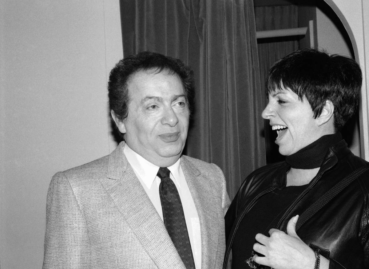 FILE - In this Feb. 4, 1991, file photo, Liza Minnelli chats with comic Jackie Mason during a v ...