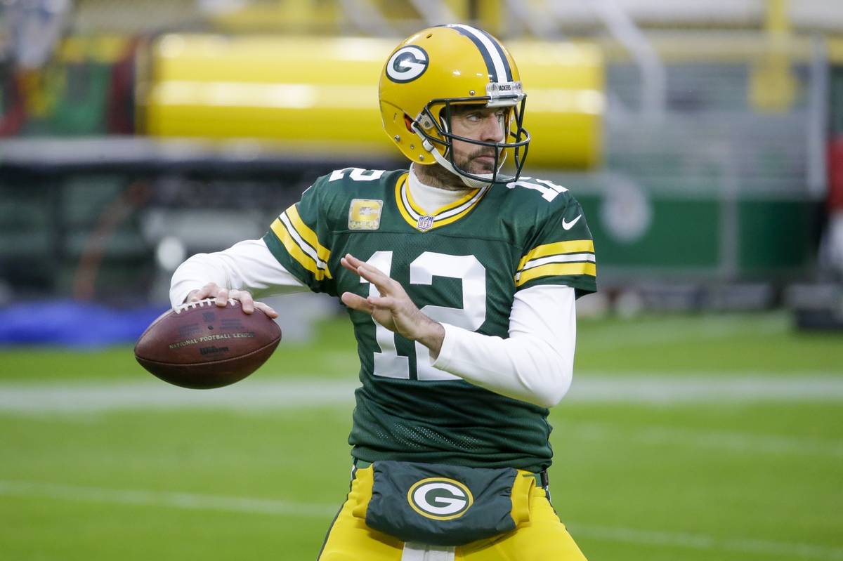 Green Bay Packers' Aaron Rodgers warms up before an NFL football game against the Jacksonville ...