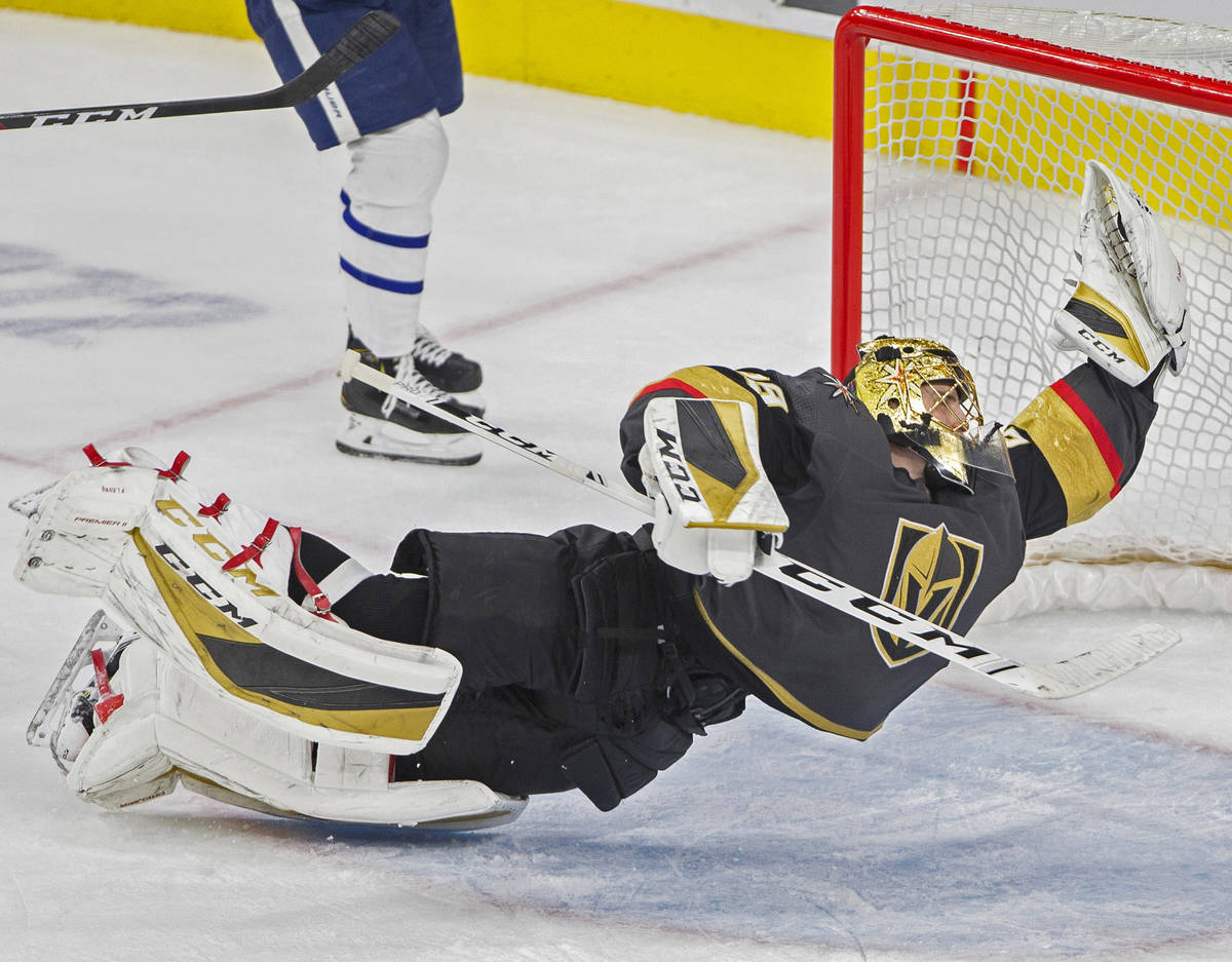 Golden Knights goaltender Marc-Andre Fleury (29) makes a diving save in the third period during ...