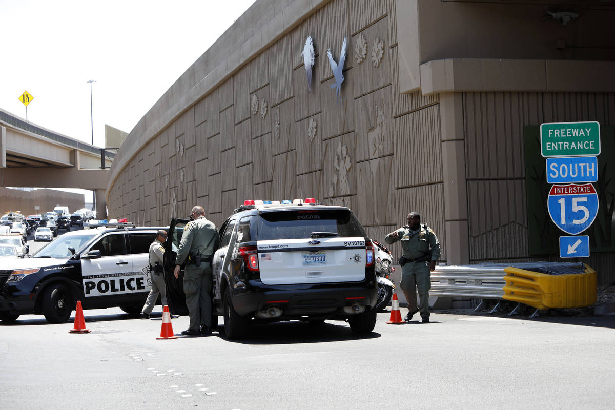 Police block Interstate 15 southbound ramp near Charleston Boulevard in Las Vegas, Tuesday, Ju ...
