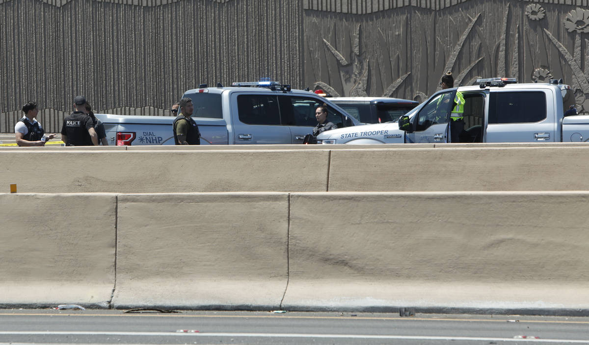 A heavy police presence is visible on Interstate 15 near Sahara Avenue in Las Vegas, Tuesday, J ...