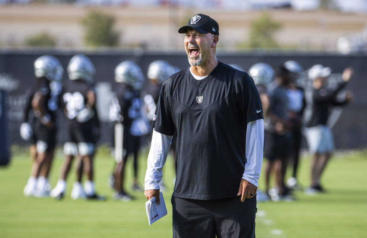 The Raiders newly acquired defensive coordinator Gus Bradley yells instructions to his players ...