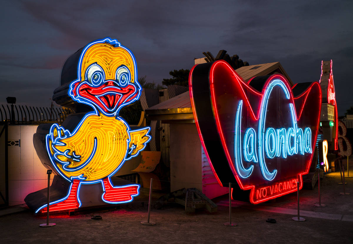 The recently restored Ugly Duckling sign stands next to the La Concha sign at the Neon Museum i ...