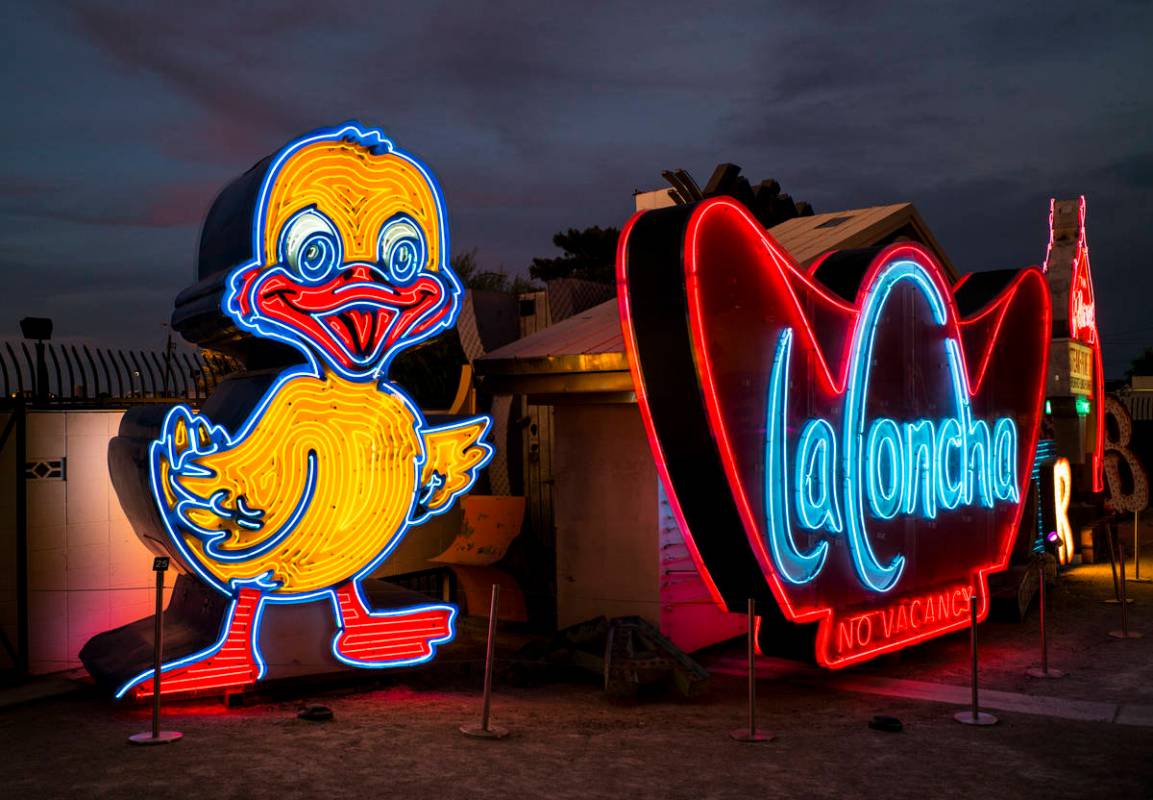 The recently restored Ugly Duckling sign stands next to the La Concha sign at the Neon Museum i ...
