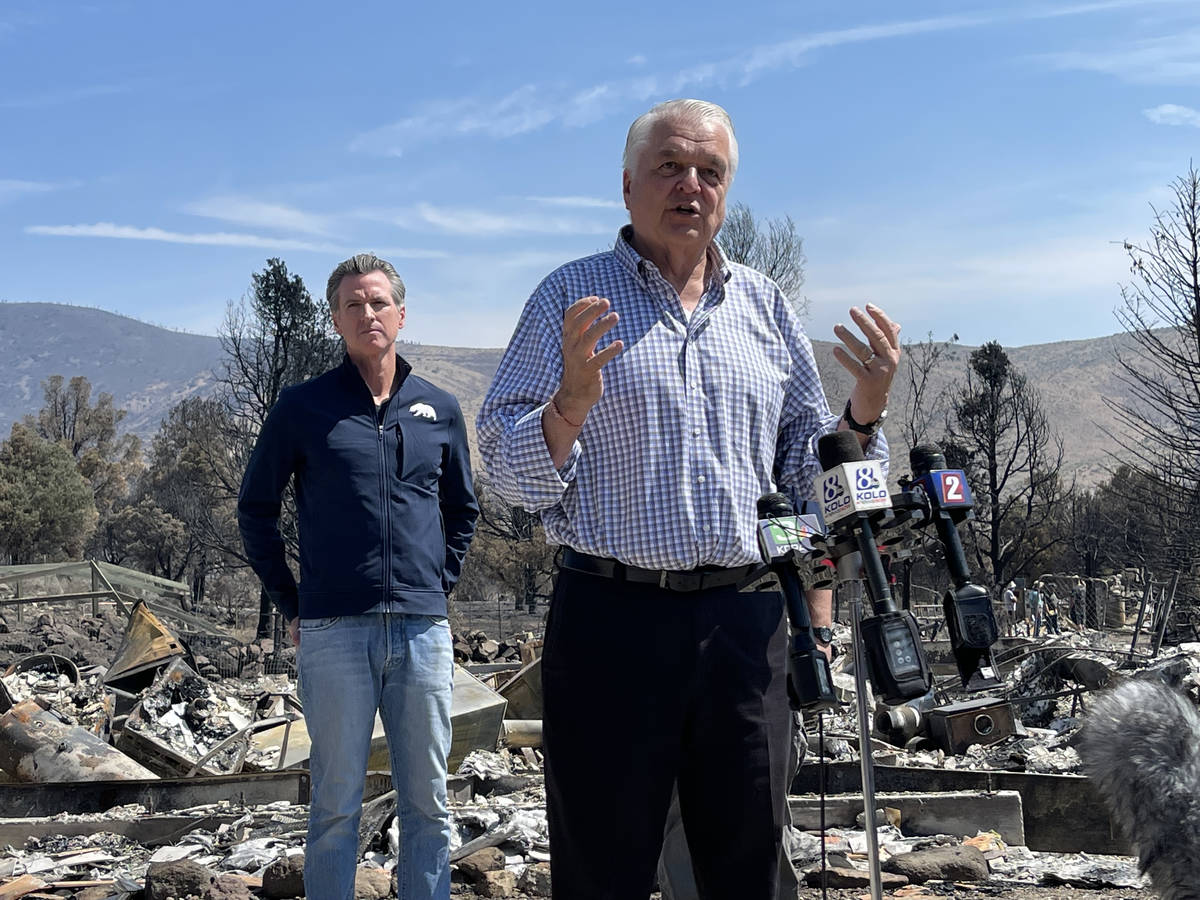 Nevada Gov. Steve Sisolak speaks to reporters Wednesday at the scene of home in Gardnerville, N ...
