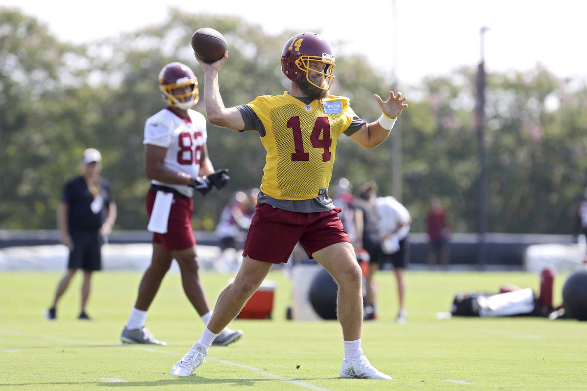 Washington Football Team quarterback Ryan Fitzpatrick (14) throws a pass during NFL football pr ...