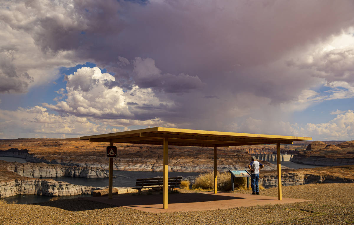 Monsoon clouds are seen from a viewpoint area at Lake Powell in the Glen Canyon National Recrea ...