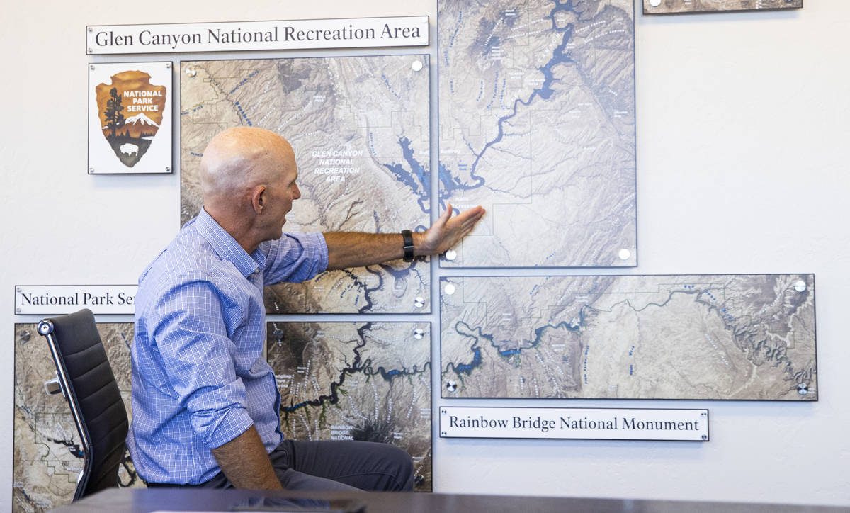 William Shott, superintendent of Glen Canyon National Recreation Area, points to a map while ta ...