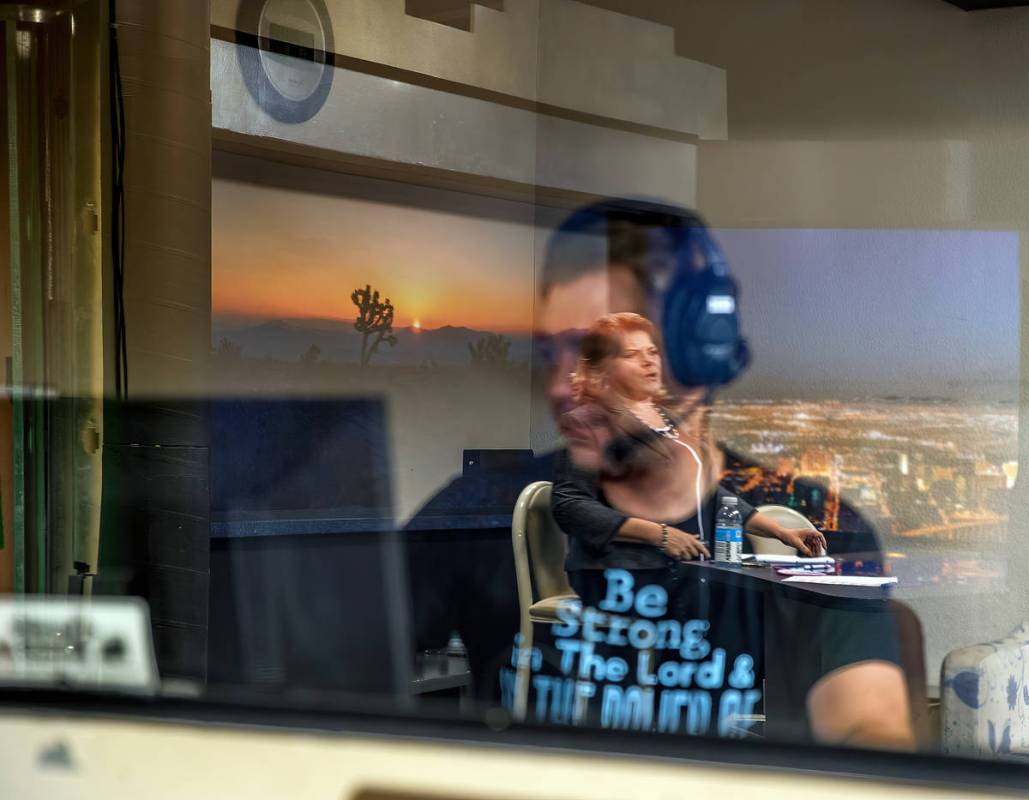 KPVM 25 Tech Coordinator Romano Frediani works in a control booth as News Director/Anchor Deann ...