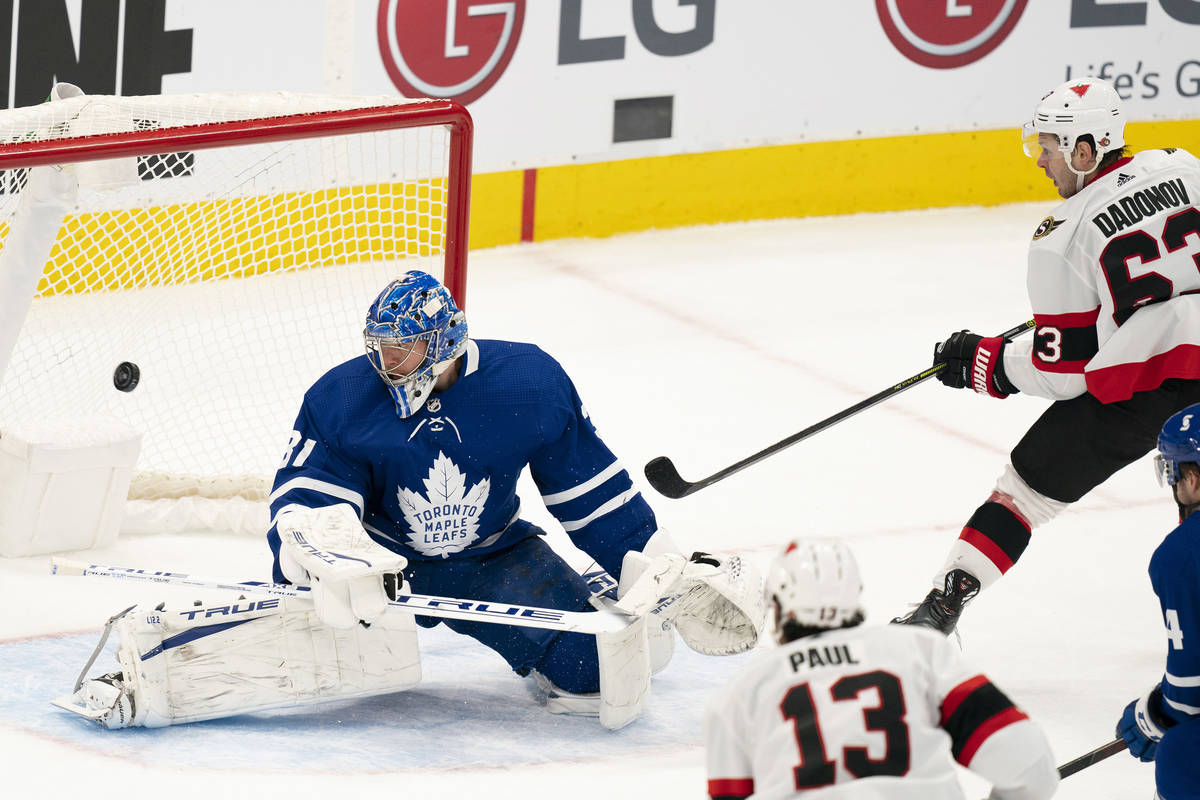 Ottawa Senators right winger Evgenii Dadonov(63) puts the puck past Toronto Maple Leafs goalten ...