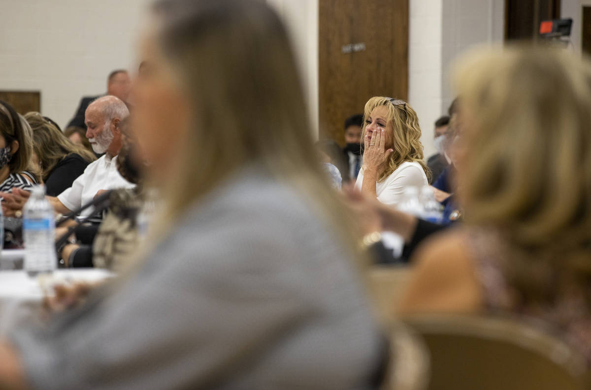 An attendee sheds a few tears along with others during a public memorial service for former Met ...