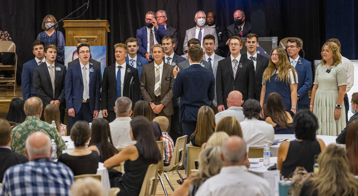 Missionaries sing during a public memorial service for former Metro Lt. Erik Lloyd who died of ...