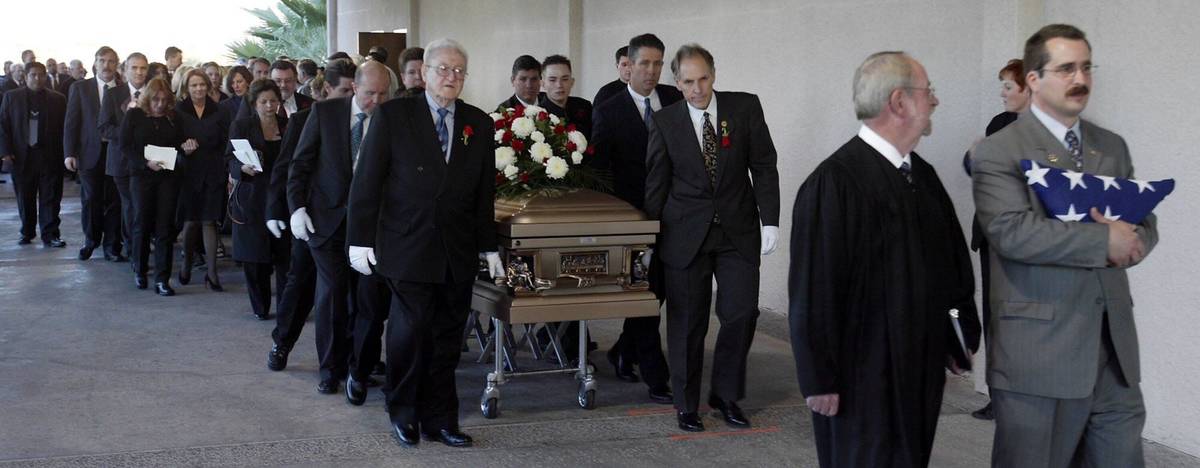 Attorney Richard Wright, right, and George Foley Sr., left, lead as they carry the casket of fo ...