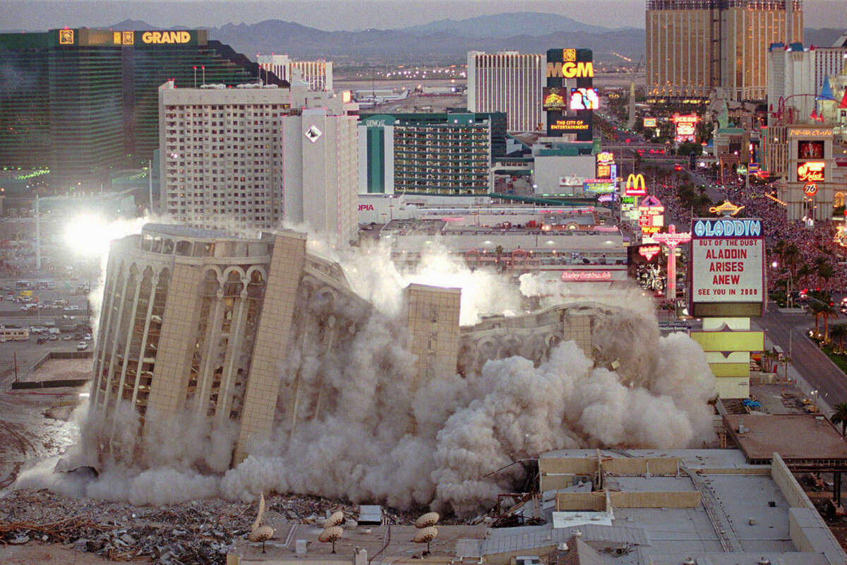 The Aladdin Hotel & Casino comes tumbling down as it is imploded, Monday night, April 27, 1998, ...