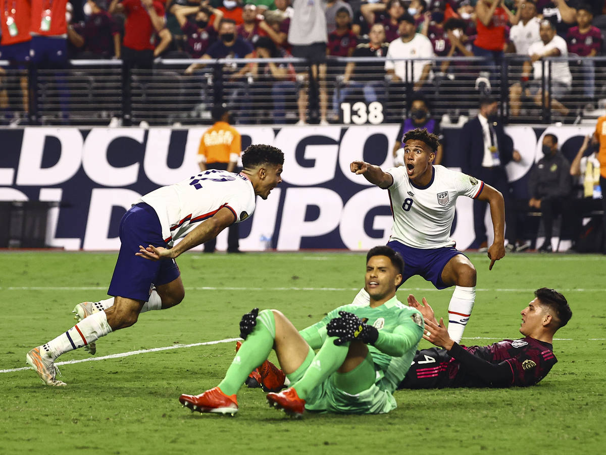 United States defender Miles Robinson, left, celebrates his goal with forward Nicholas Gioacchi ...