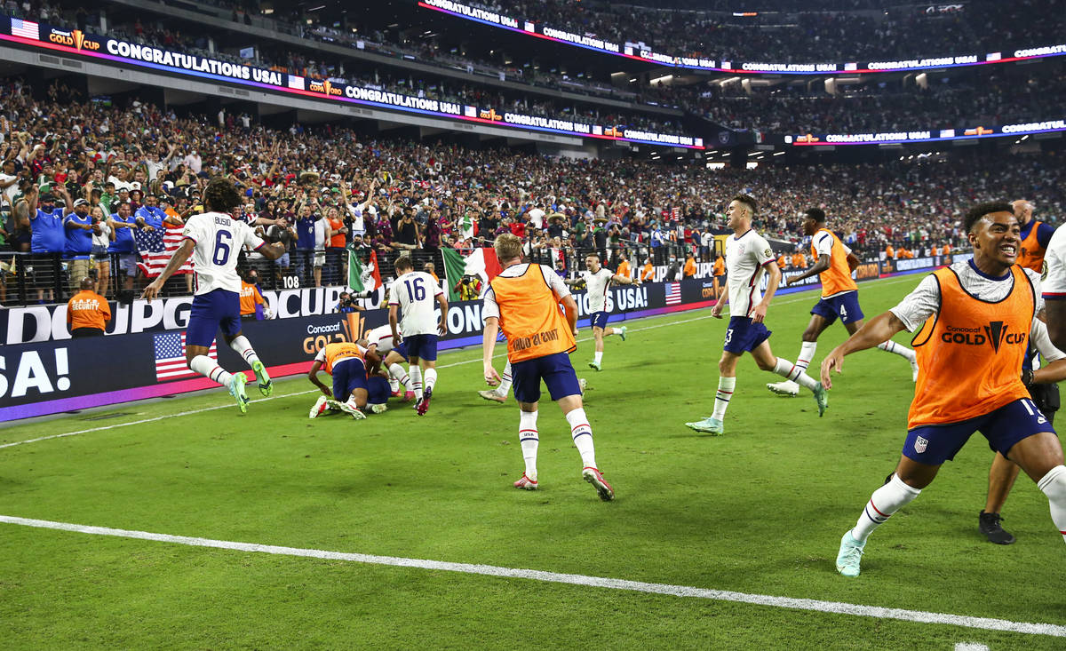 United States players celebrate after defeating Mexico 1-0 in extra time to win the Concacaf Go ...