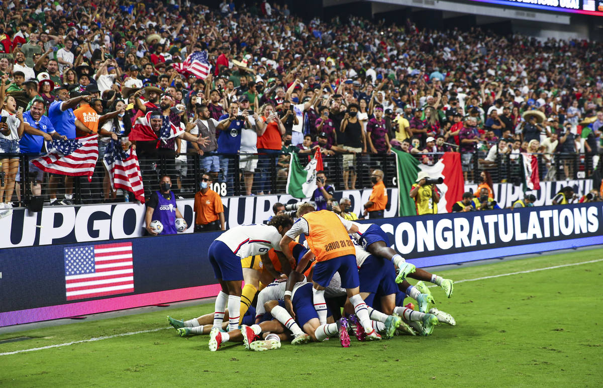 United States players celebrate after defeating Mexico 1-0 in extra time to win the Concacaf Go ...