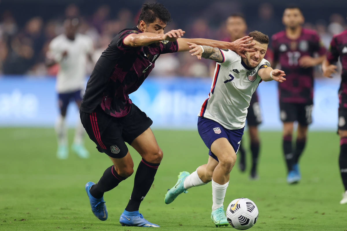 Mexico defender Nestor Araujo pokes the eye of United States forward Paul Arriola (7) before ge ...