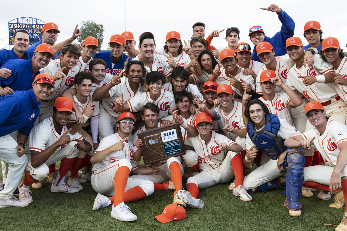 Bishop Gorman High School players celebrate their victory against Palo Verde in the Class 5A re ...