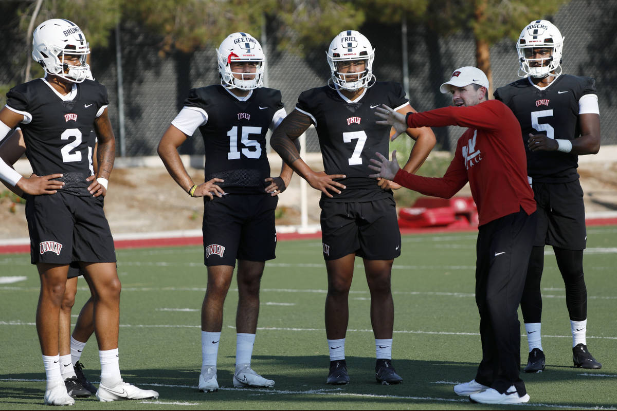 UNLV Rebels quarterbacks Doug Brumfield (2), Matthew Geeting (15), Cameron Friel (7), Justin Ro ...