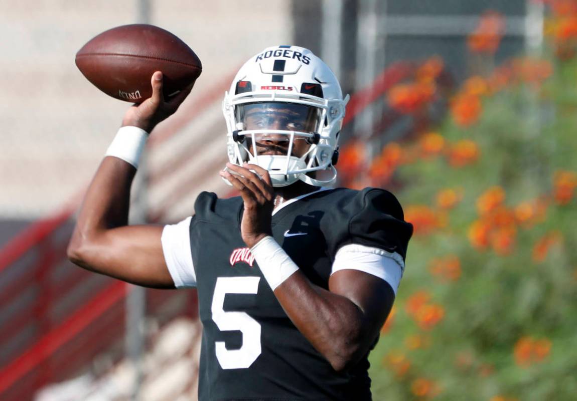 UNLV Rebels quarterback Justin Rogers (5) throws a ball during football practice in UNLV, Wedne ...