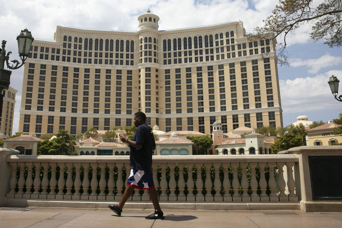 Pedestrian walk past the Bellagio on Friday, Aug. 28, 2020, in Las Vegas. (Bizuayehu Tesfaye/L ...