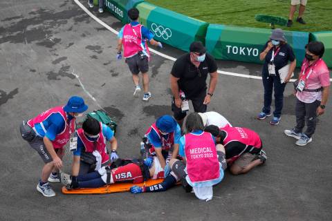 Medics prepare to carry away on a stretcher Connor Fields of the United States after he crashed ...