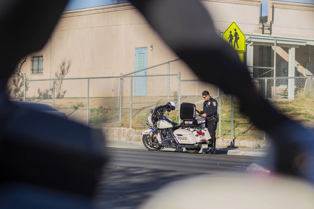 Officer Chris Deuel of "Fab Five," the five-member traffic unit of Clark County Schoo ...