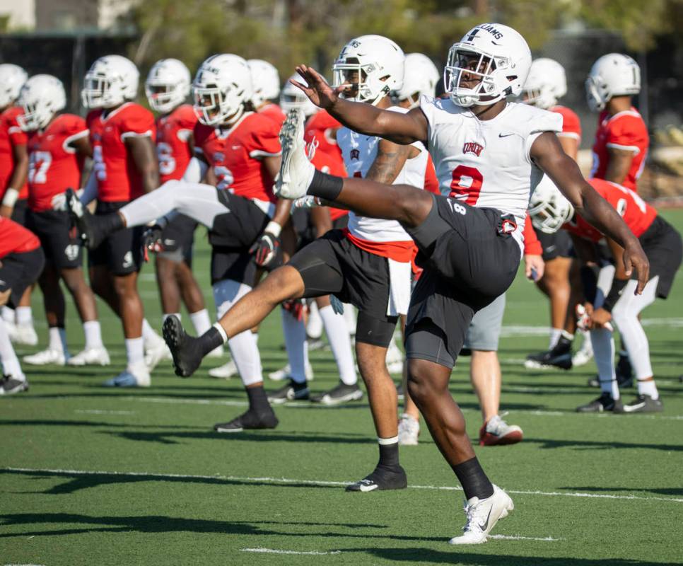 UNLV running back Charles Williams (8) stretches during a drill in football team practice at Re ...