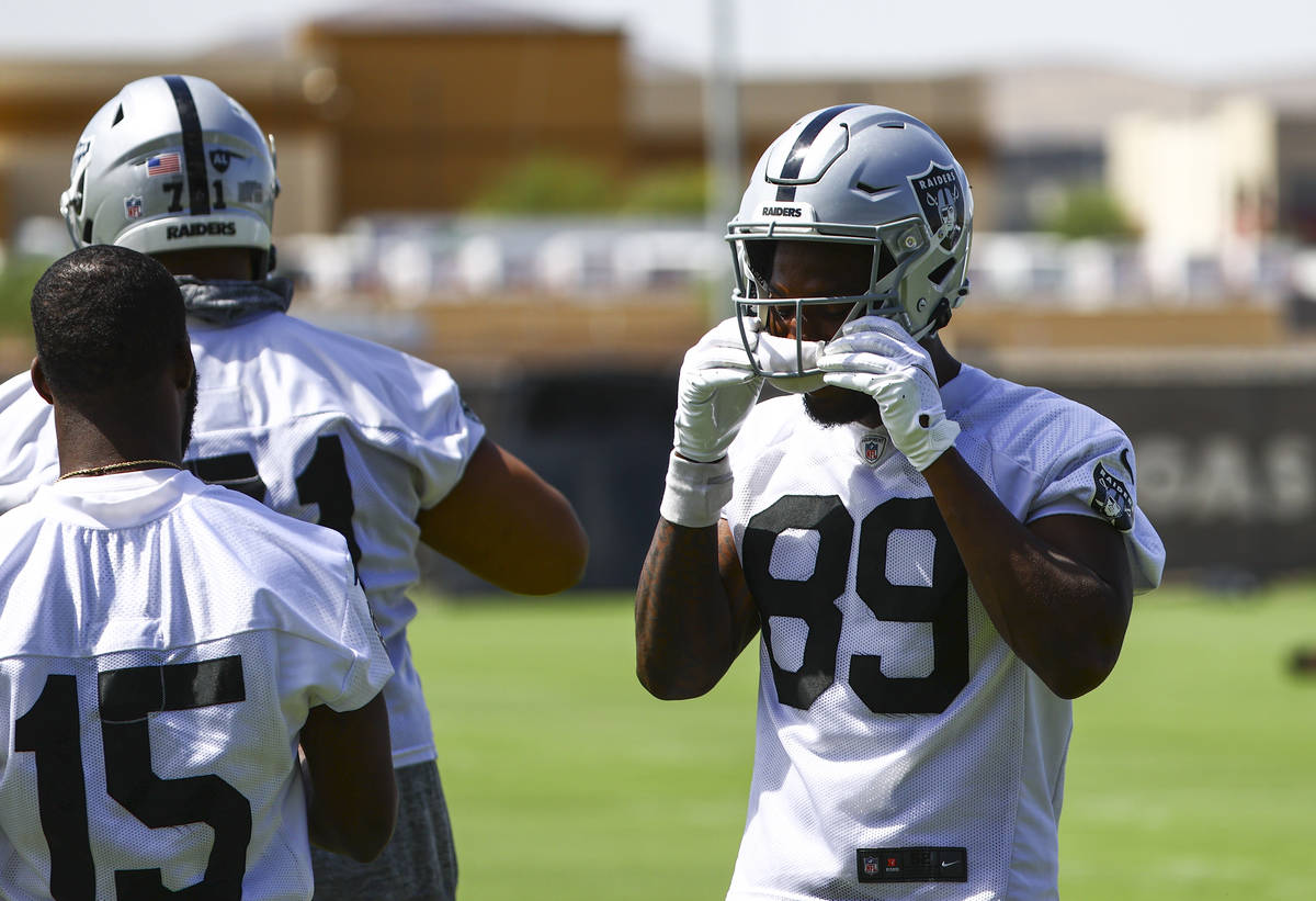 Raiders wide receiver Bryan Edwards (89) adjusts his helmet during NFL football practice at Rai ...