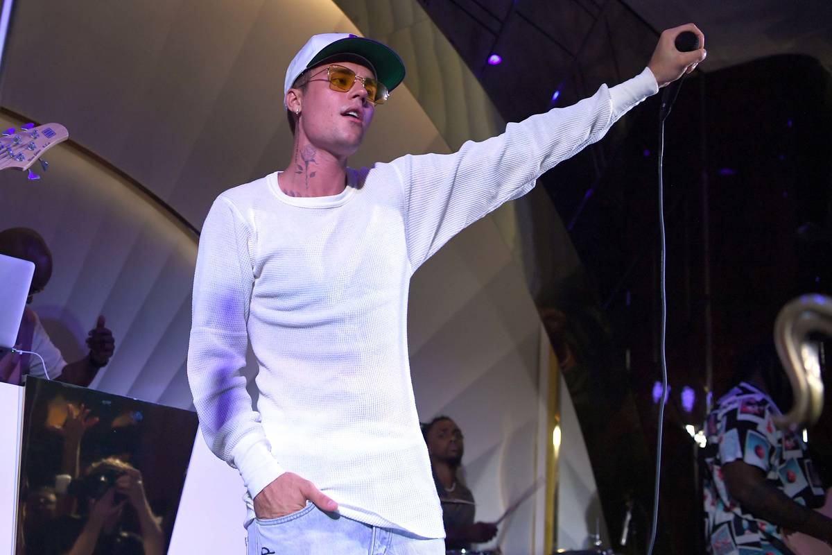 Justin Bieber performs onstage during h.wood Group's grand opening of Delilah at Wynn Las Vega ...