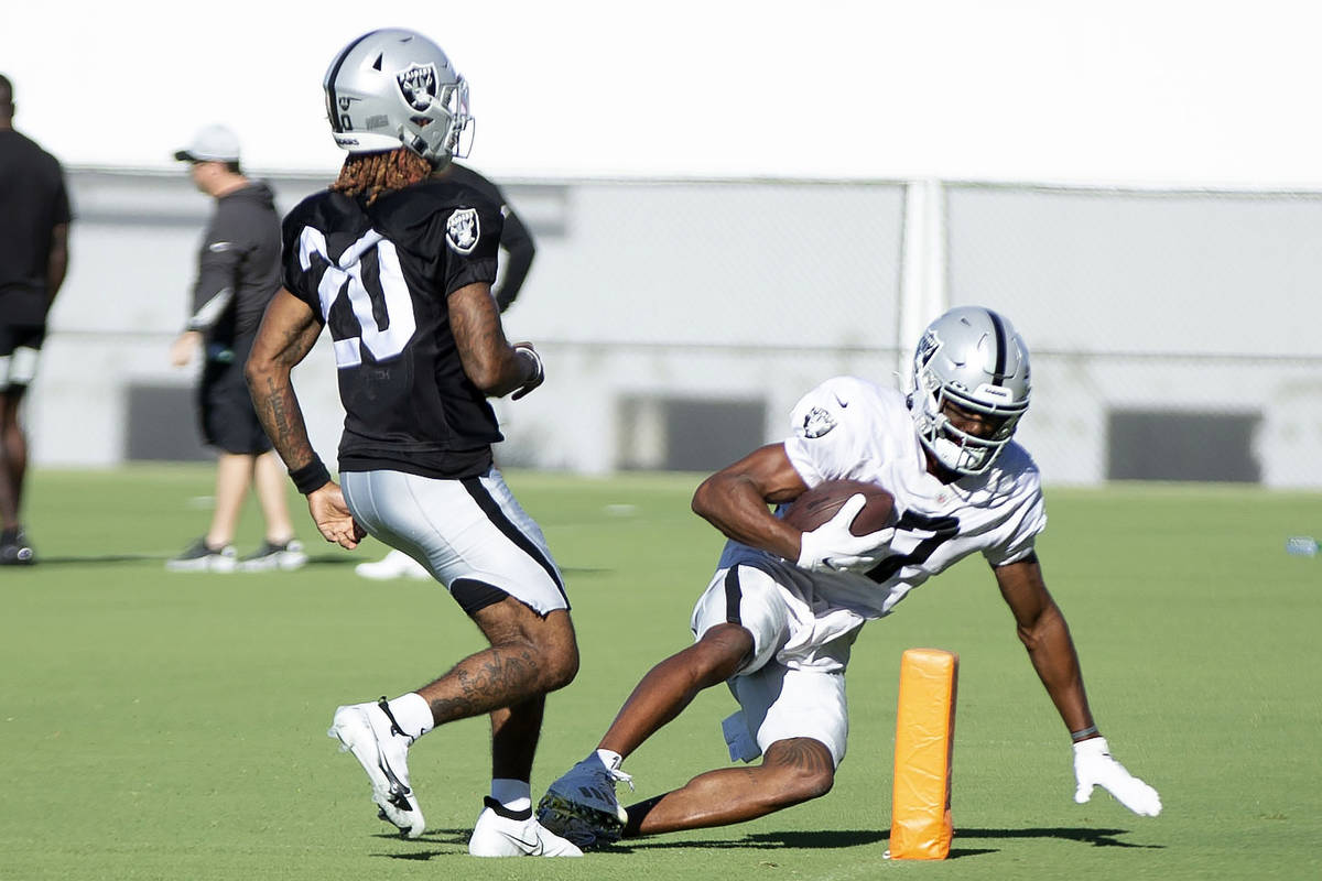 Raiders wide receiver Zay Jones (7) scores a touchdown over cornerback Damon Arnette (20) durin ...