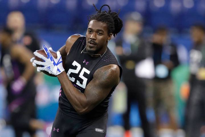 Alabama running back Bo Scarbrough runs a drill during the NFL football scouting combine, Frida ...