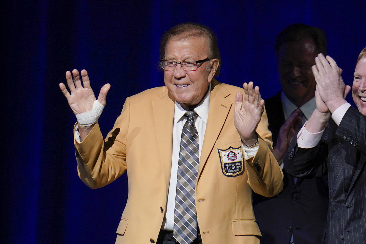 Tom Flores, a member of the Pro Football Hall of Fame Centennial Class, receives his gold jacke ...