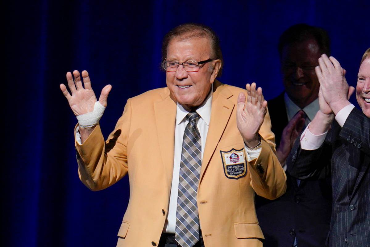 Tom Flores, a member of the Pro Football Hall of Fame Centennial Class, receives his gold jacke ...