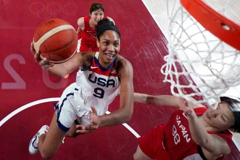United States's A'Ja Wilson (9) drives past Japan's Himawari Akaho (88) during a women's gold m ...