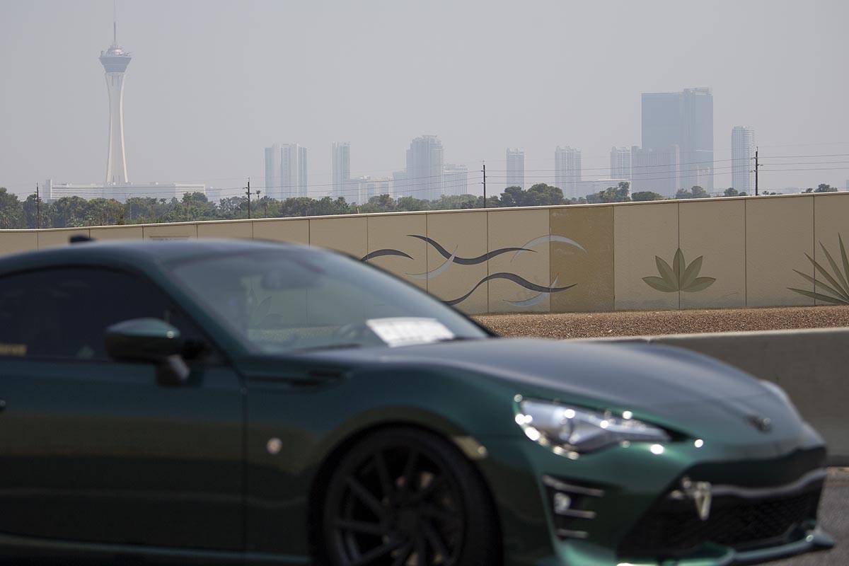 A motorist exits onto Valley View Drive from U.S. 95 as smoky skies cloud the Las Vegas Strip s ...