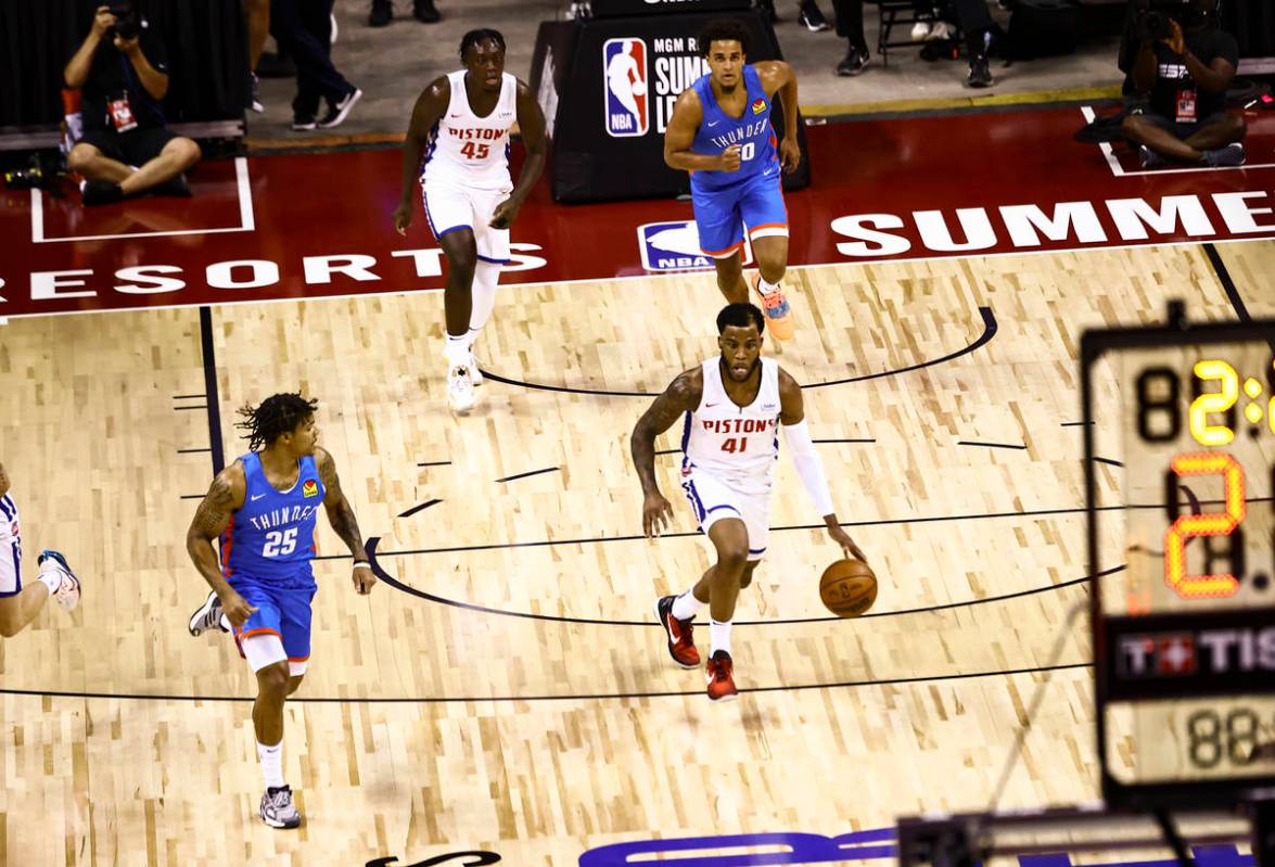 Detroit's forward Saddiq Bey (41) brings the ball up court against Oklahoma City's Rob Edwards ...