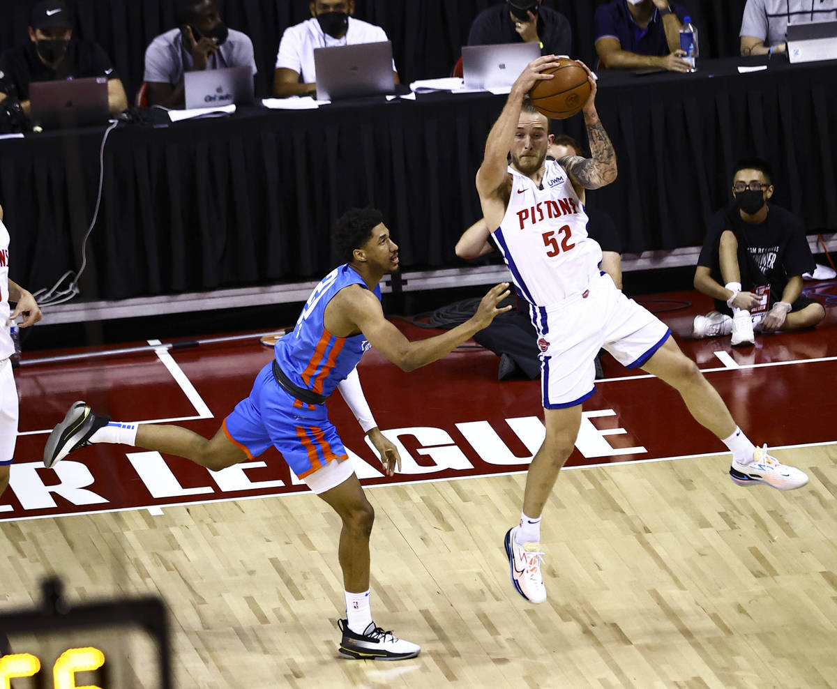 Detroit's Spencer Littleson (52) catches a loose ball in front of Oklahoma City's Aaron Wiggins ...