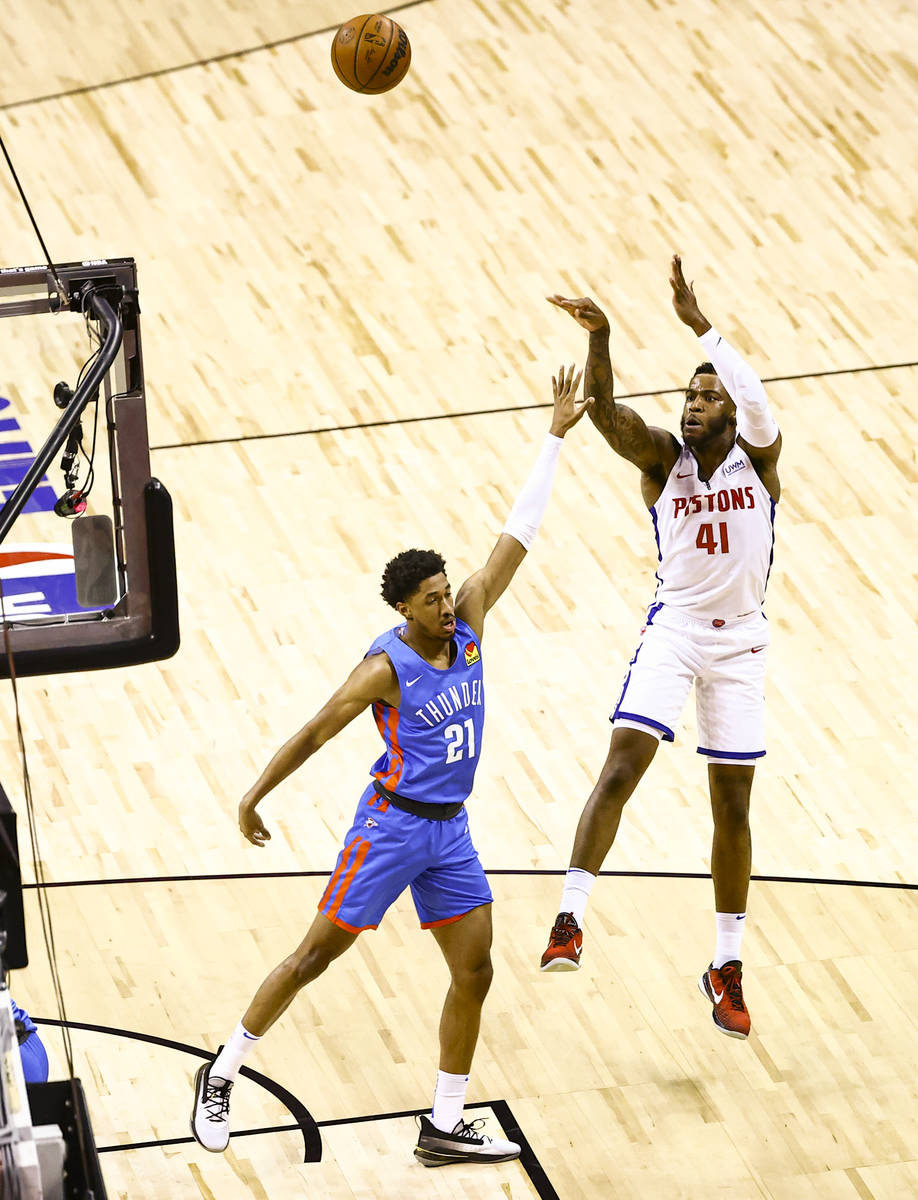 Detroit's Saddiq Bey (41) shoots over Oklahoma City's Aaron Wiggins (21) during the first half ...