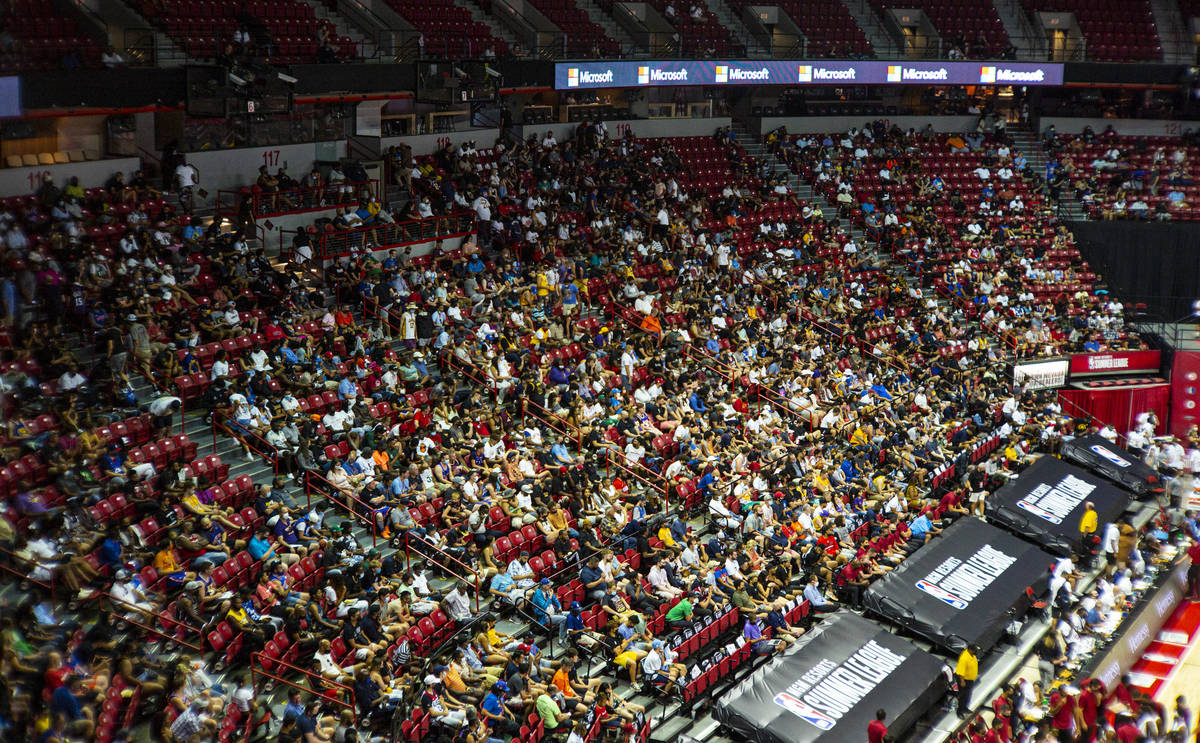 Basketball fans watch as the Detroit Pistons play the Oklahoma City Thunder during the first ha ...