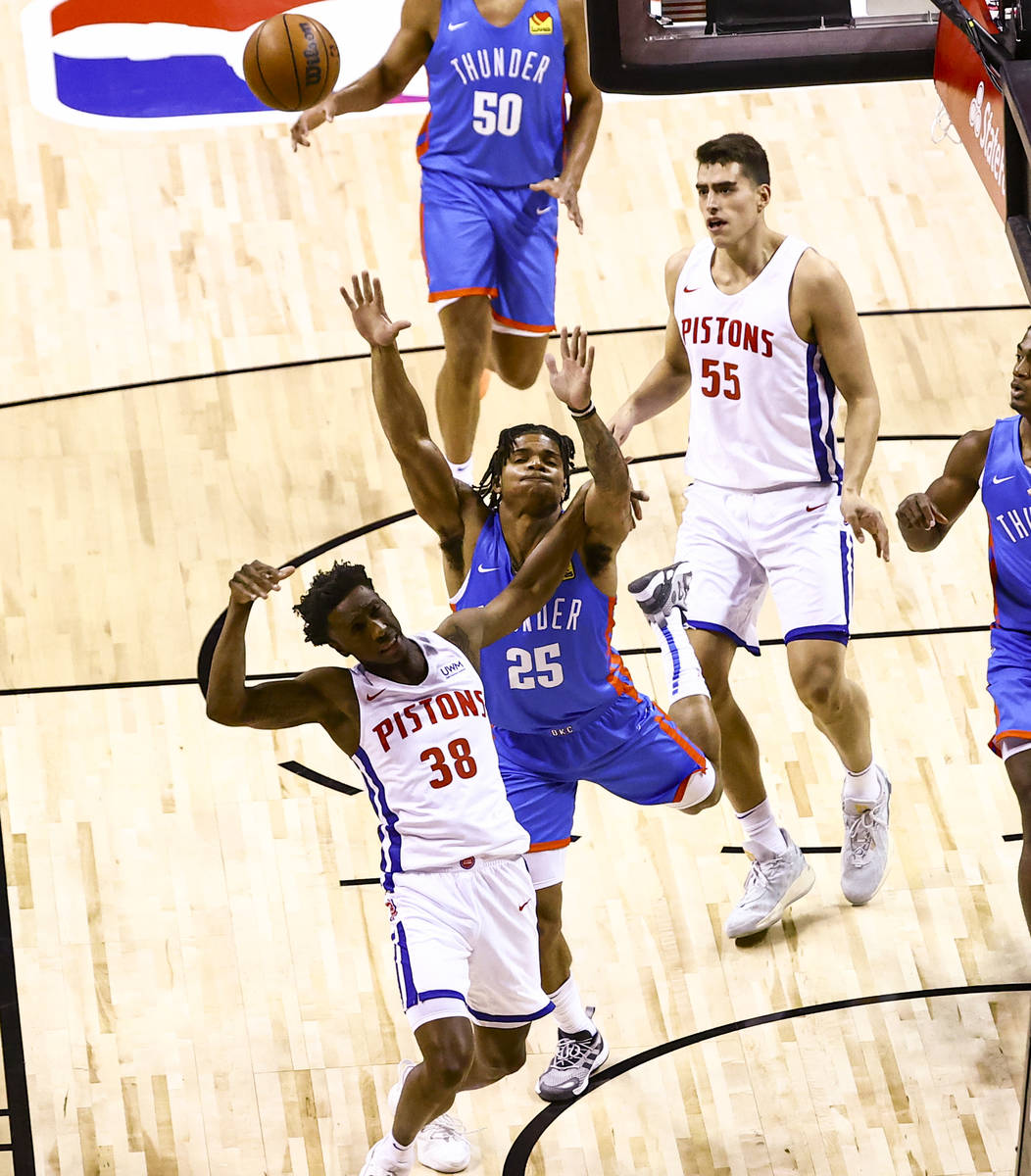 Detroit's Saben Lee (38) and Oklahoma City's Rob Edwards (25) collide while trying to get the b ...