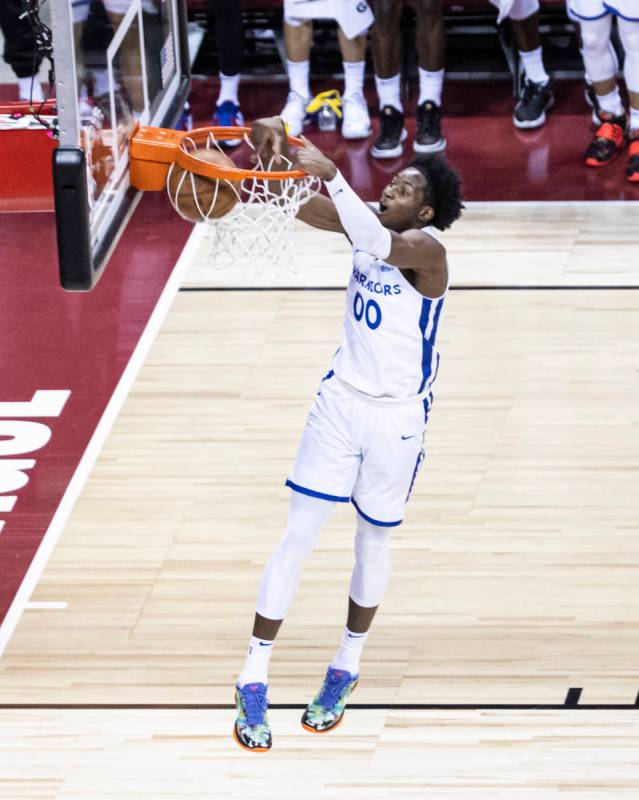 Golden State's Jonathan Kuminga (00) dunks against Orlando during the first half of an NBA Summ ...